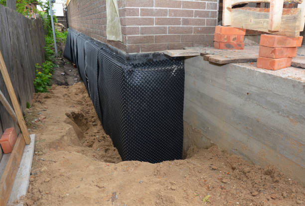 SJ Waterproofing Pros technician performing targeted Waterproofing assessment in Liberty, NC